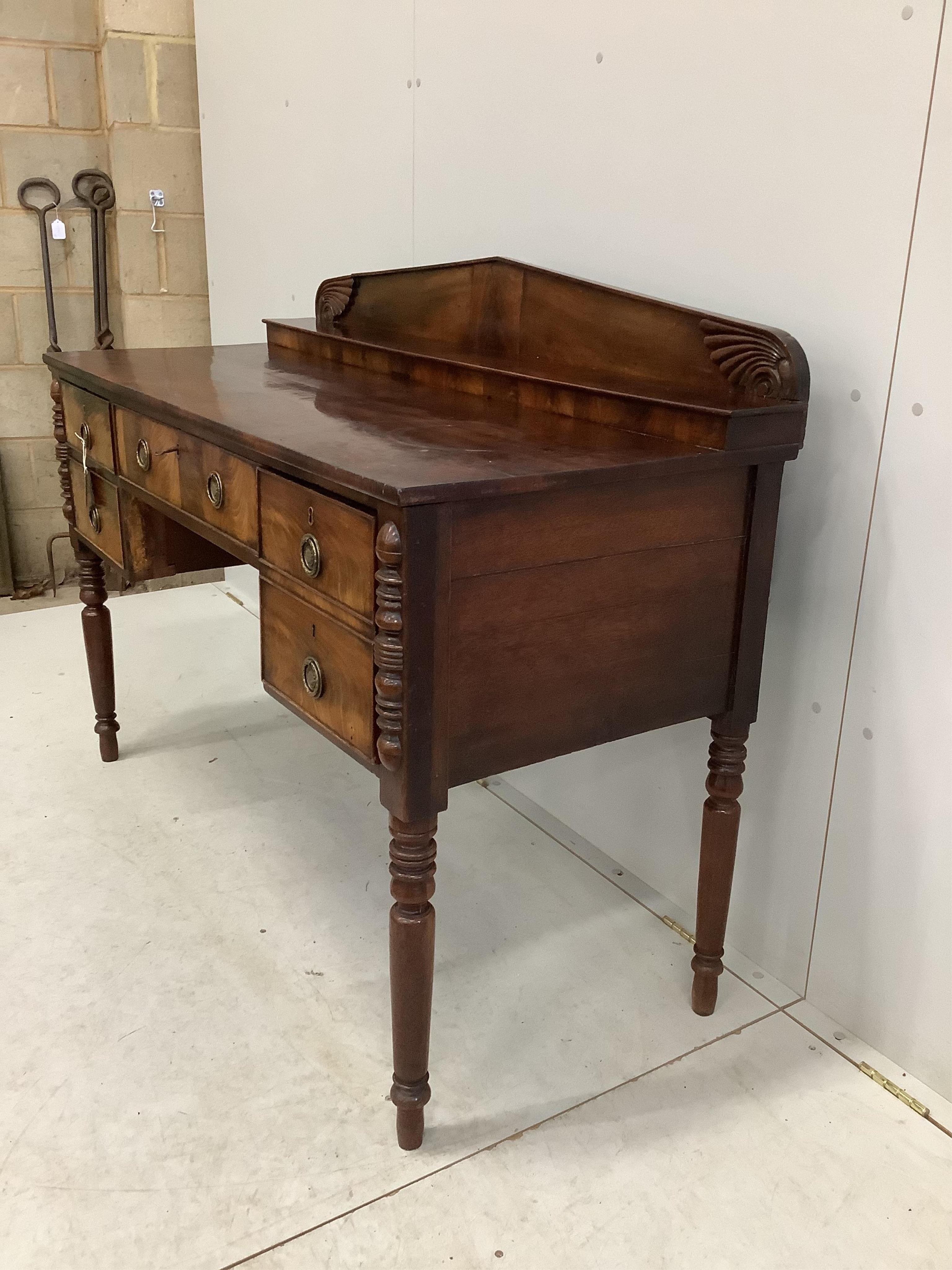 A Regency mahogany sideboard, width 126cm, depth 58cm, height 103cm. Condition - fair but missing two pieces of moulding to kneehole